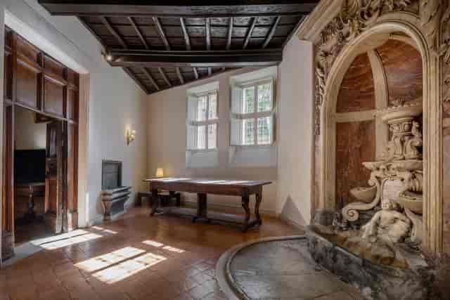 S. Agostino Hall venue with central fountain for intimate boardroom meetings and private dining.