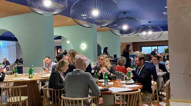 Corporate luncheon at Ristorante AcquaViva, Hotel Villa Pamphili, modern networking event space.