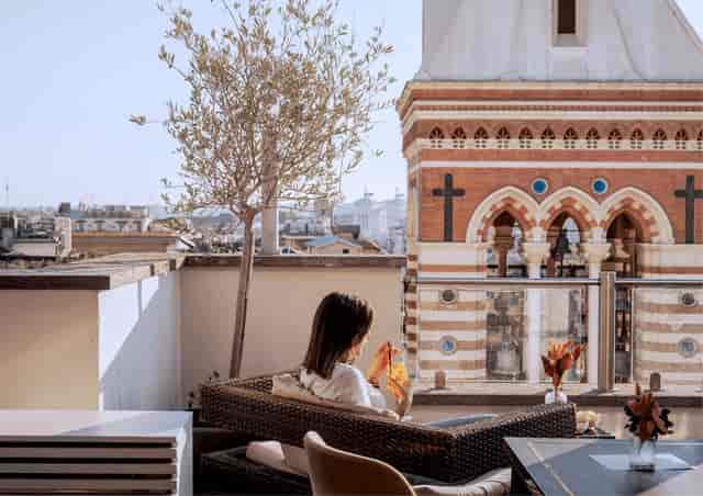 Rooftop hotel bar with historic skyline view for VIP networking and corporate reception events.