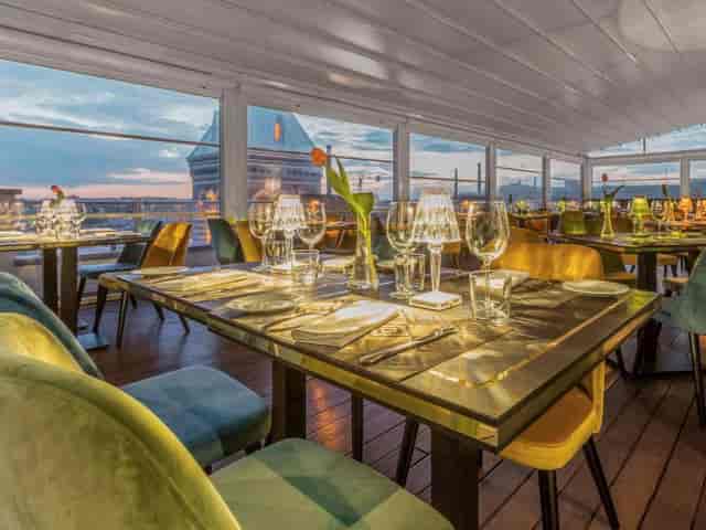 Rooftop observation deck with velvet seating for corporate reception and upscale VIP dinner events.