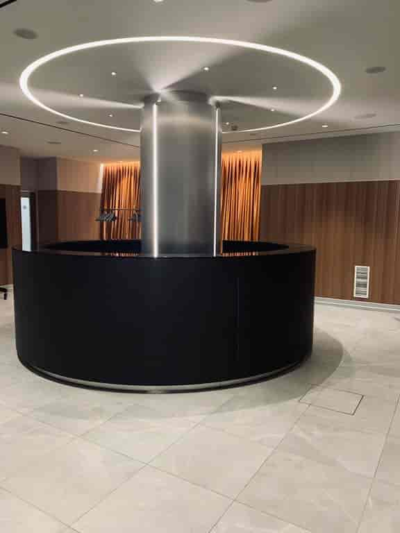 Modern circular registration desk in Hotel St. Martin foyer for corporate event and conference.