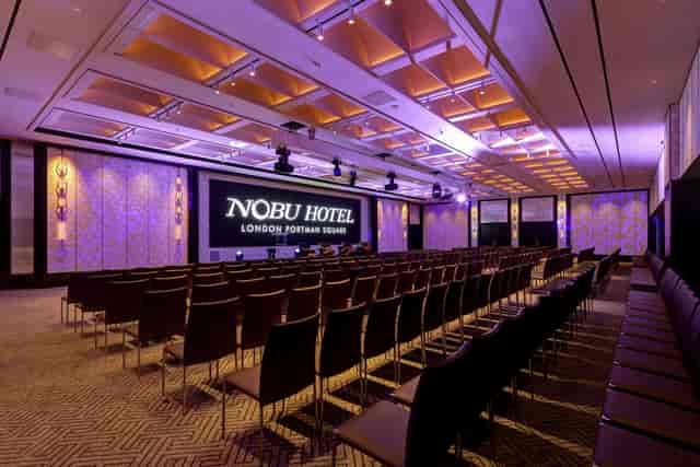 Sakura Conference Room theater setup with modern lighting for corporate presentations and launches.