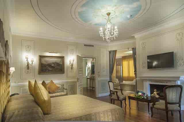 Luxury suite at Radisson Blu Rome, perfect for VIP speaker accommodations and executive events.