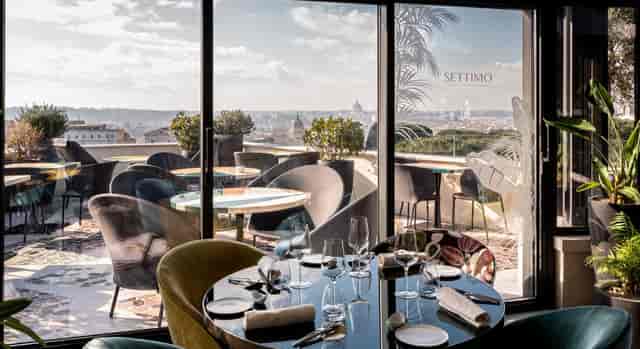 Rooftop restaurant in Suite Ludovisi with Roman city view for corporate dinners and networking.