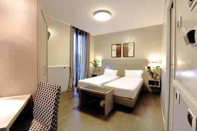 Twin-occupancy hotel room at Noba Hotel & Residenze for conference accommodation.