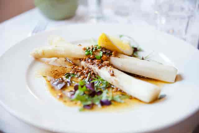 White asparagus starter dish at Hotell Zinkensdamm for corporate gala or executive lunch.