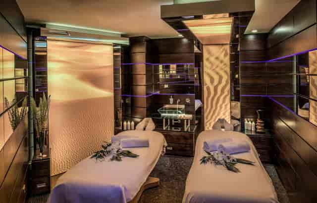 Luxury wellness suite with dual treatment tables for executive retreats and incentive travel.