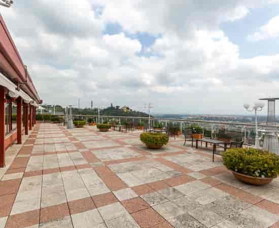 Rooftop breakout space at Hotel Rome Cavalieri with city views for corporate networking and events.