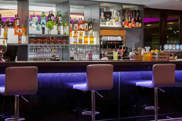Sleek hotel bar at La Fata Ignorante, iQ Hotel Roma; ideal for networking and corporate events.