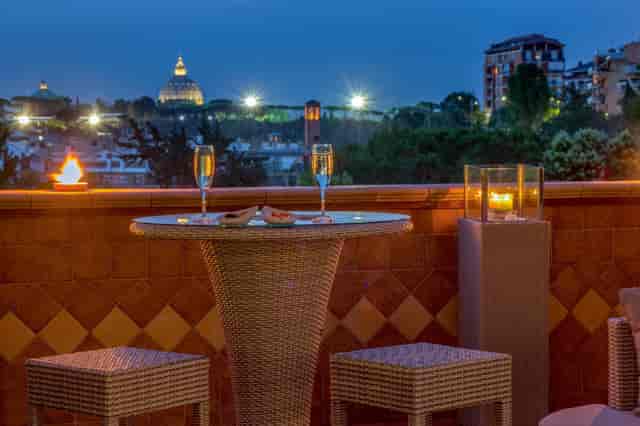 Villa Aurelia rooftop bar terrace with St. Peter’s Basilica view for VIP corporate events.