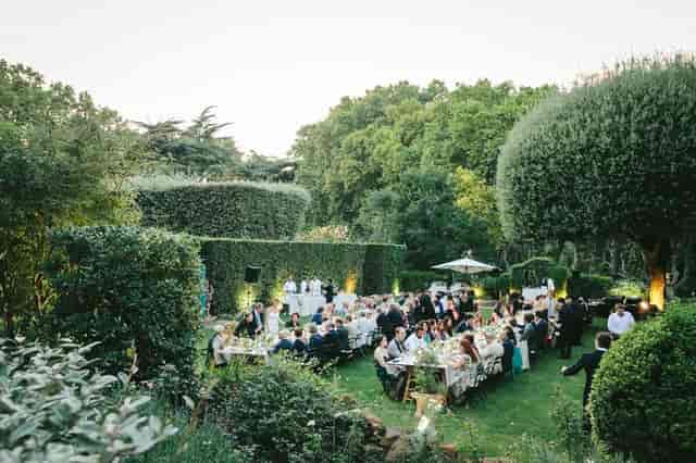 Villa Aurelia garden gala, long dining tables, luxury outdoor event venue, wedding reception.