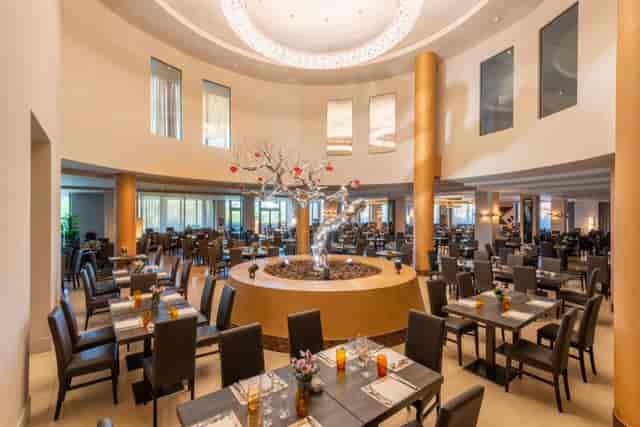 Saturno + Cerere event space with architectural centerpiece for corporate networking and dinners.