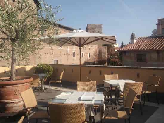Rooftop terrace overlooking Colosseo, ideal for boutique receptions and executive networking events.