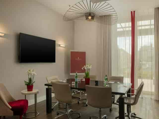 Executive boardroom at NH Collection Roma Palazzo Cinquecento for strategy meetings and events.
