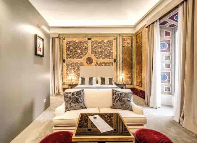 Luxury hotel suite with historic architecture, perfect for VIP accommodations and executive events.