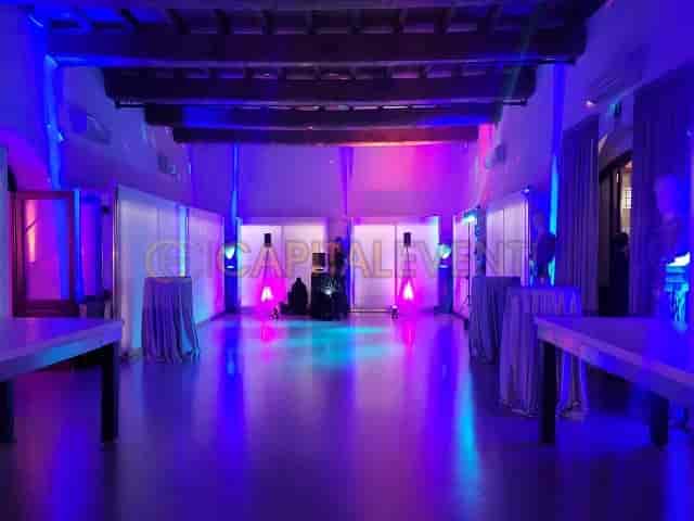 Cocktail reception at Domus Circo Massimo with atmospheric up-lighting for corporate events.