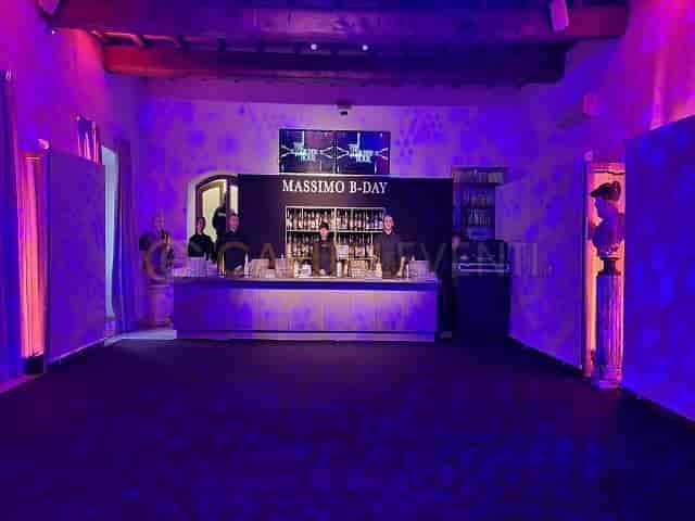 Custom bar wrap and gobo lighting at Domus Circo Massimo for private event venue branding.