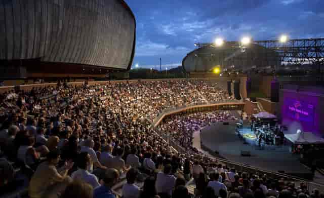 Spazio Risonanze outdoor venue with tiered seating for evening concerts and music festivals.
