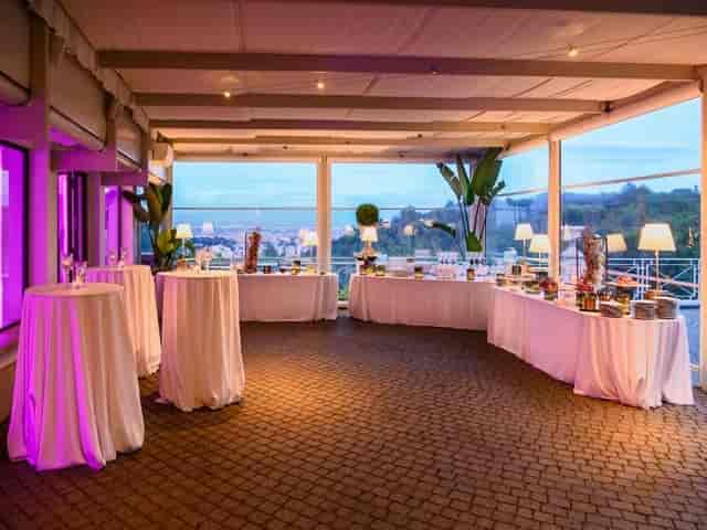 Villa Parco della Vittoria cocktail reception with ambient lighting and panoramic views.