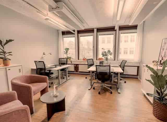 Coworking space at 7A Odenplan featuring workstations and lounge seating for office events.