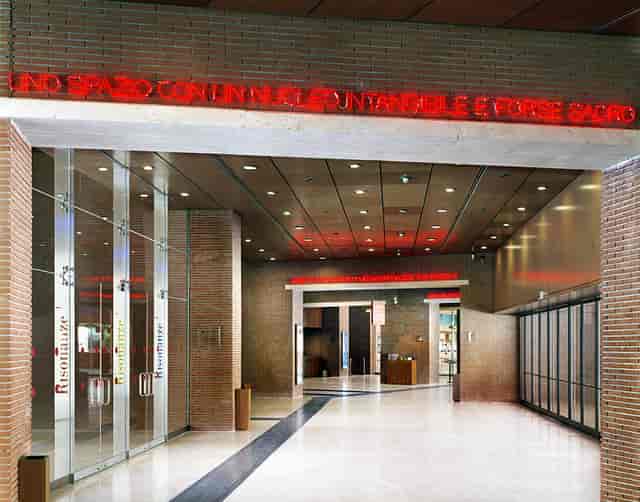 Modern auditorium foyer, sophisticated entrance, ideal for executive conferences and receptions.