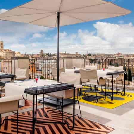 Rhinoceros Rooftop high-end restaurant with panoramic city views for luxury corporate networking.