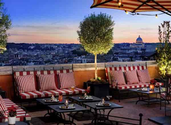 Luxury rooftop lounge in Rome with skyline views, perfect for VIP receptions and cocktail events.