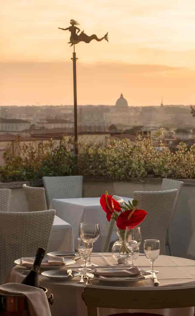 Ligea Lounge Bar rooftop terrace with Roman backdrop for executive cocktail networking events.