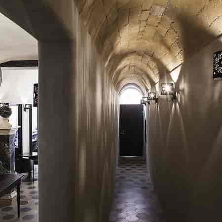 Vaulted stone corridor at Casa de' Coronari, ideal for luxury breakout space or evening reception.
