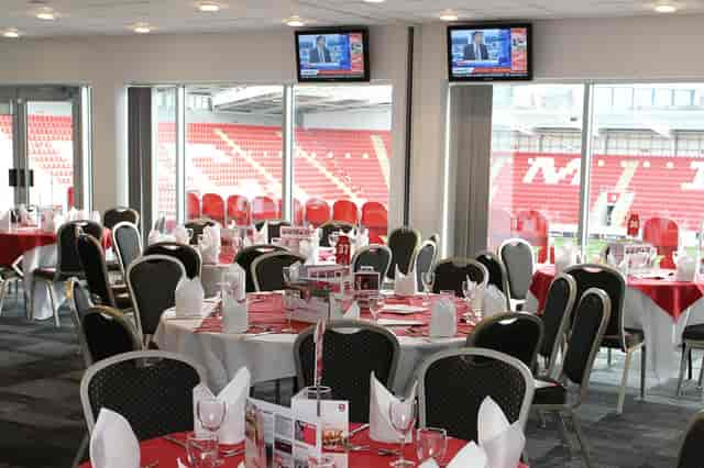 Corporate banquet event at AESSEAL New York Stadium suite with high-impact branding.