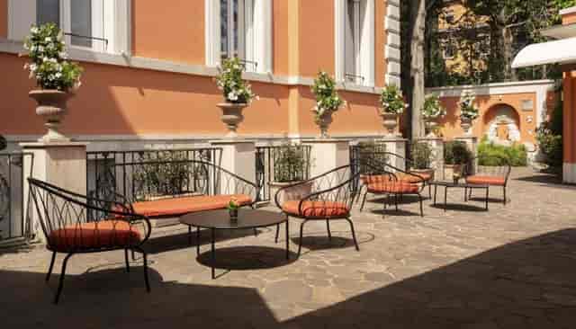 VIP reception garden at Hotel degli Aranci with ambient decor for intimate corporate events.
