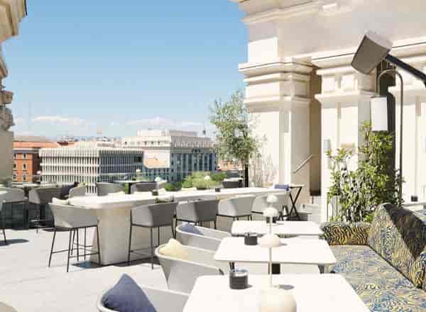 Rooftop cocktail bar at Azotea Cibeles with lounge seating for networking events.