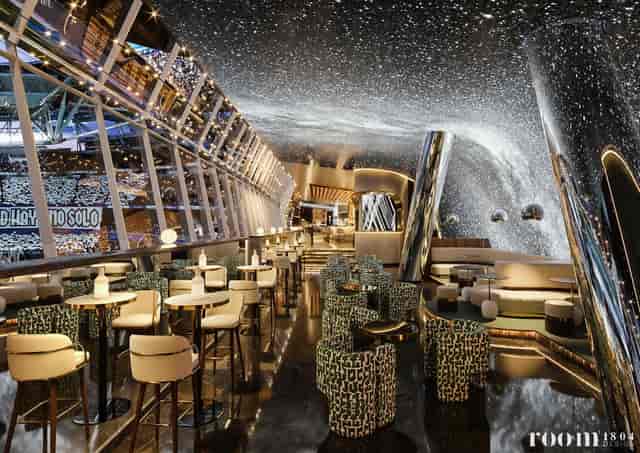 VIP lounge at Bernabéu Stadium with striking ceiling for corporate events and networking.