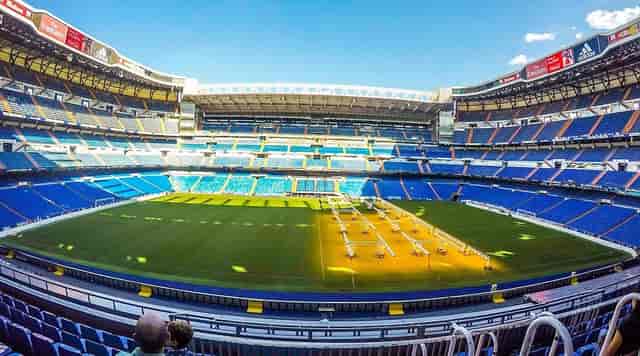 Bernabéu stadium press room and turf-protected venue for corporate events and stadium tours.