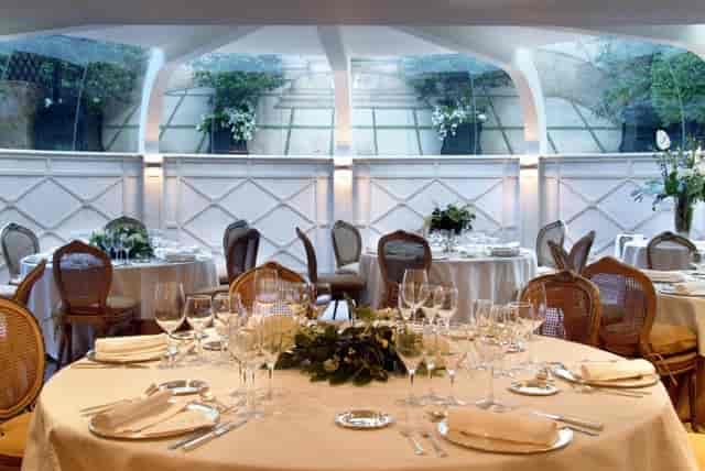 Upscale glass-ceiling garden restaurant for sophisticated dinner or luncheon events.