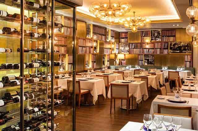 Private dining suite with floor-to-ceiling wine storage for executive board meetings and VIP events.