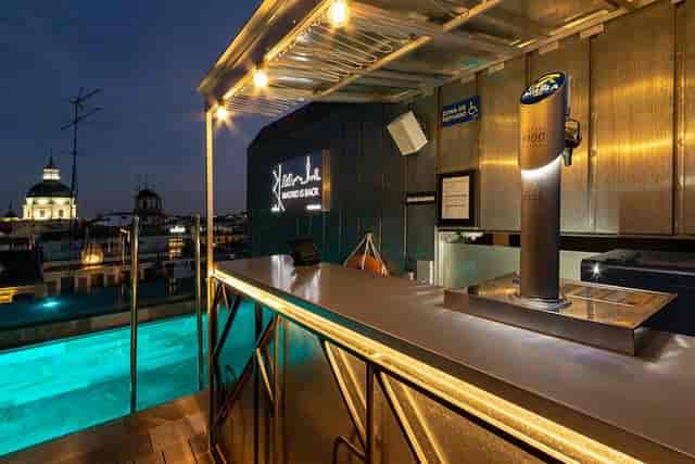 Rooftop pool bar at Pestana Plaza Mayor Madrid for premium brand activations and evening mixers.