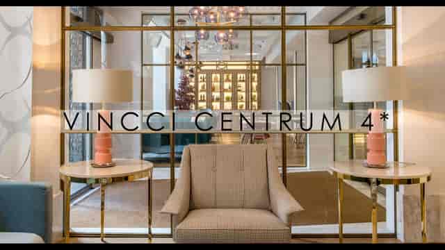 Vincci Centrum hotel lobby with glass partitions for small group networking and corporate events.