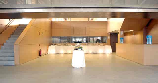 Fundación Canal event foyer with cocktail tables for corporate receptions and coffee breaks.