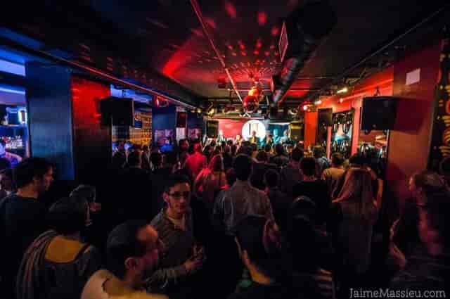 Nightclub networking mixer at Tempo Club with immersive mood lighting.