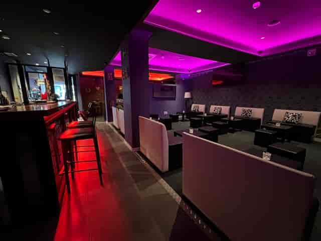 Modern function room lounge with banquette seating for VIP receptions and networking events.