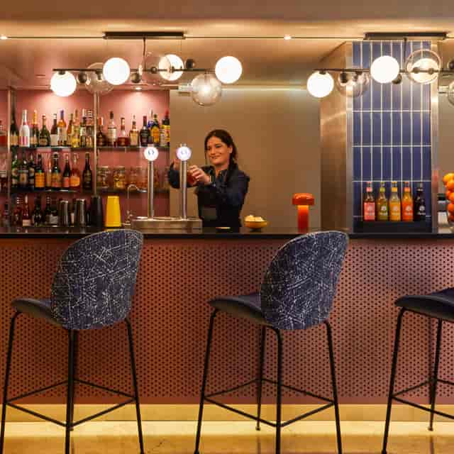 Stylish lounge bar at voco Madrid Retiro for networking receptions and corporate events.