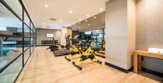 Hotel fitness center at ILUNION Pío XII, ideal for corporate events and wellness conferences.