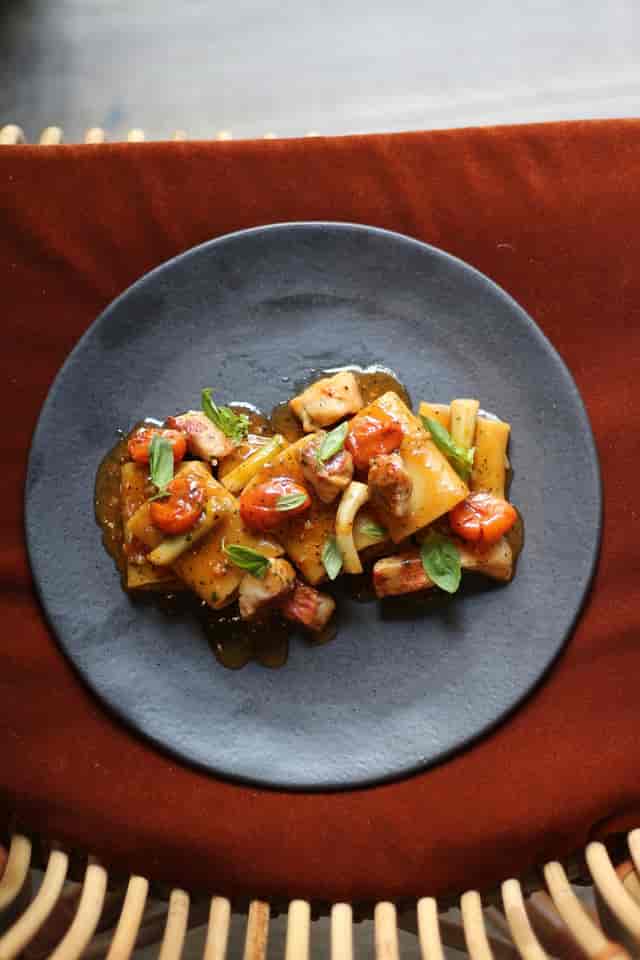 Upscale plated entrée at Tragaluz Madrid terrace for gala dinner and VIP lunch catering.