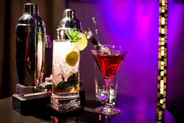 Premium beverage bar at AC Hotel Recoletos, expertly lit for an evening reception or event.