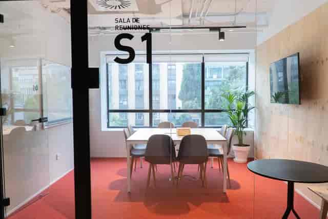Meeting Room 2: Small huddle room with AV for collaborative team meetings and professional workspace.