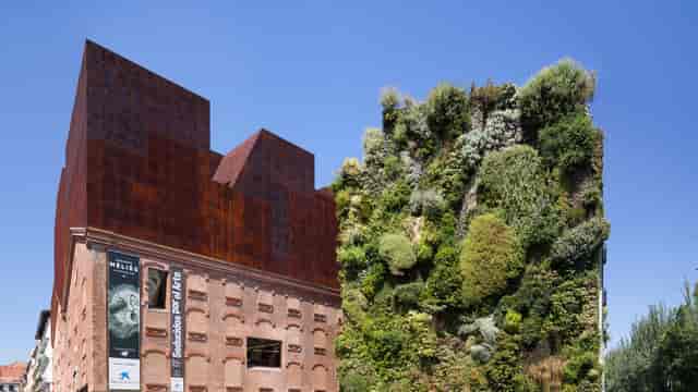 CaixaForum Madrid exhibition hall with industrial architecture for experiential corporate events.