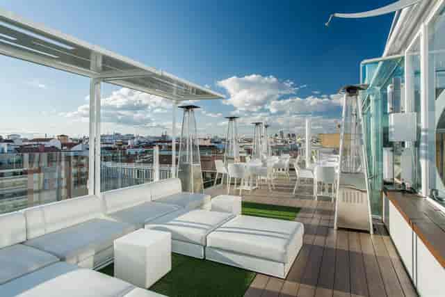 Rooftop cocktail reception at Room Mate Óscar with panoramic city views, event venue.
