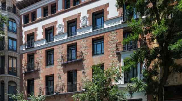 Boutique hotel exterior at One Shot Fortuny, historic architecture for corporate retreats.