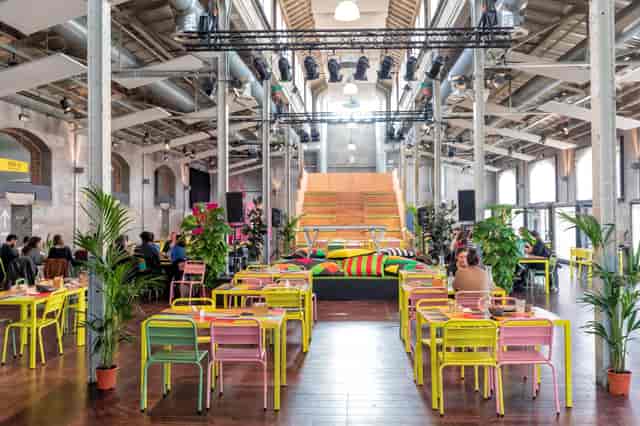 Terrario Matadero Madrid industrial venue with tiered stage for workshops and networking events.
